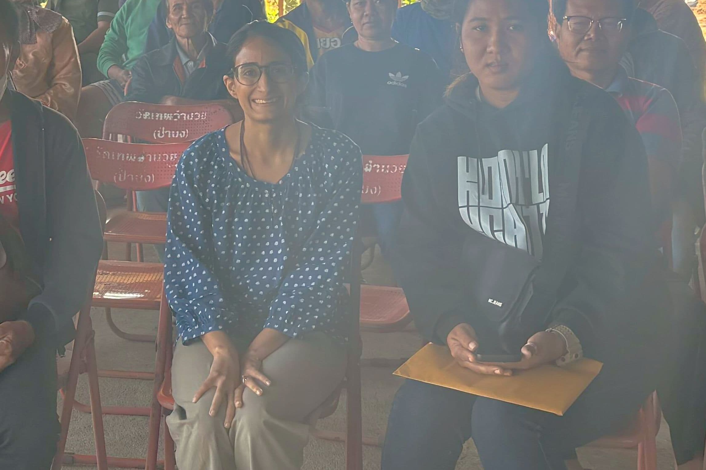 Living Roots co-founder meeting with a farmer